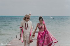 Cute indian bride and groom's first look capture. Cute indian bride and groom's first look capture.