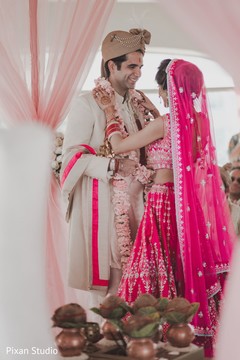 Indian bride and groom at their varmala ceremony. Indian bride and groom at their varmala ceremony.