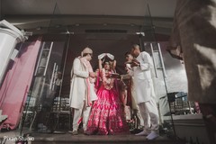 Indian bride throwing rice on her back. Indian bride throwing rice on her back.