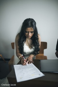 Indian bride signing paperwork. Indian bride signing paperwork.