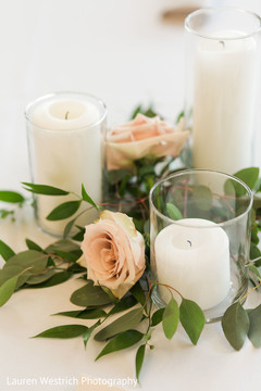 Elegant Indian wedding candle and roses table decor. Elegant Indian wedding candle and roses table decor.