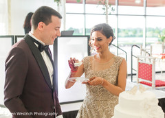 Lovely capture Indian bride giving cake to the groom. Lovely capture Indian bride giving cake to the groom.