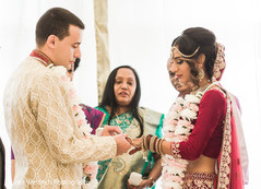 Indian groom putting ring to bride. Indian groom putting ring to bride.