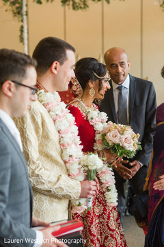 Indian couple holding flowers bouquets. Indian couple holding flowers bouquets.
