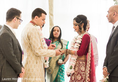 See this lovely couple exchanging wedding rings. See this lovely couple exchanging wedding rings.