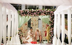 Indian bride and groom under the mandap. Indian bride and groom under the mandap.