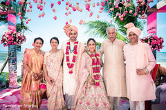 Lovely picture of the newlyweds with their families. Lovely picture of the newlyweds with their families.