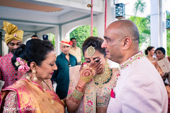 Indian bride with family having a romantic moment. Indian bride with family having a romantic moment.