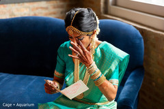 Enchanting Indian bride reading grooms letter. Enchanting Indian bride reading grooms letter.