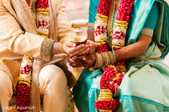 Indian couple holding the areca nut.