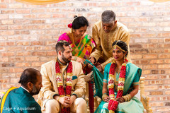 Indian couple being tied up ritual.