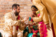 Indian couple sharing food ritual.