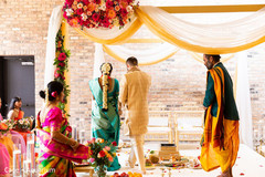 Indian couple making the seven steps around sacred fire.
