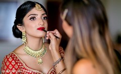 Makeup artist assisting the Maharani. Makeup artist assisting the Maharani.