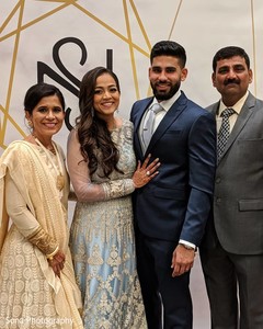 Adorable indian couple posing with family. Adorable indian couple posing with family.