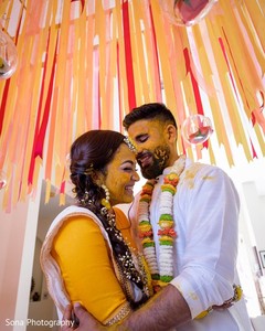 Indian couple smeared all over with turmeric paste. Indian couple smeared all over with turmeric paste.