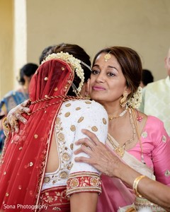 Indian bride saying goodbye to mother. Indian bride saying goodbye to mother.
