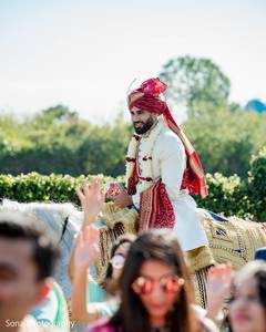 Enchanting Indian groom at his baraat procession capture. Enchanting Indian groom at his baraat procession capture.