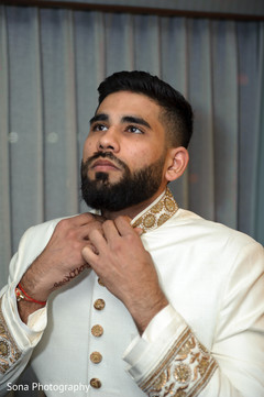 Charming Indian groom getting ready. Charming Indian groom getting ready.