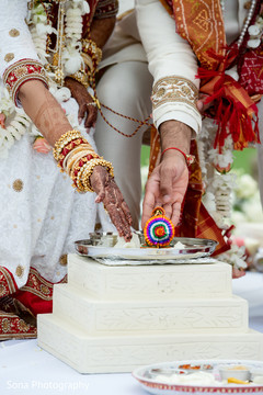Indian couple making offerings to sacred fire Indian couple making offerings to sacred fire