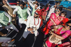 Indian groom dancing during baraat Indian groom dancing during baraat