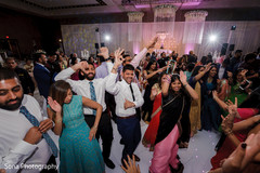 Indian wedding guests showing some dance moves Indian wedding guests showing some dance moves