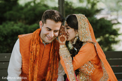 Lovely Indian bride telling her groom a secret. Lovely Indian bride telling her groom a secret.