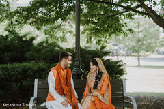 Adorable Indian couple sitting together at the park. Adorable Indian couple sitting together at the park.