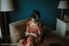 Lovely Indian bride reading groom's letter. Lovely Indian bride reading groom's letter.