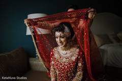 Indian bride being assisted with the veil. Indian bride being assisted with the veil.
