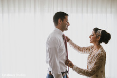 Lovely Indian bride assisting his groom. Lovely Indian bride assisting his groom.
