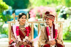 Lovely Indian couple sitting at their ceremony. Lovely Indian couple sitting at their ceremony.