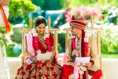 Charming Indian couple reading their vows. Charming Indian couple reading their vows.