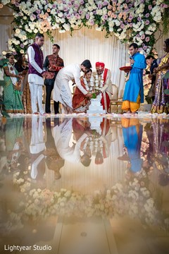 Indian couple making offerings to sacred fire Indian couple making offerings to sacred fire