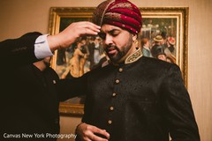 Charming Indian groom getting his turban on. Charming Indian groom getting his turban on.