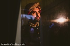 Indian groom looking out the window. Indian groom looking out the window.
