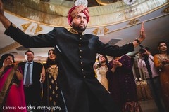 Indian groom dancing at reception party. Indian groom dancing at reception party.