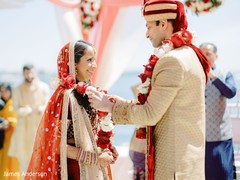 Indian groom putting flower garland to bride. Indian groom putting flower garland to bride.