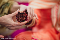 Indian bride being assisted with the jewelry. Indian bride being assisted with the jewelry.