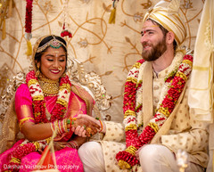 Indian bride and groom holding hands Indian bride and groom holding hands