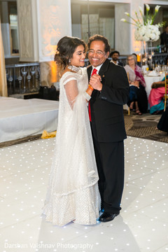 Lovely Indian bride dancing with father. Lovely Indian bride dancing with father.