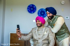 Charming Indian groom taking a selfie. Charming Indian groom taking a selfie.