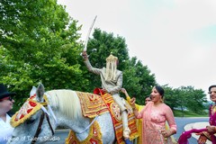 Charming Indian groom on his white baraat horse. Charming Indian groom on his white baraat horse.
