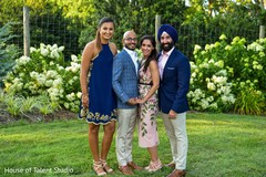 Marvelous Indian couple posing with relatives capture. Marvelous Indian couple posing with relatives capture.