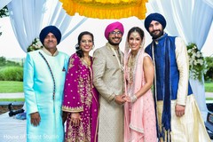 Adorable indian couple posing with family. Adorable indian couple posing with family.