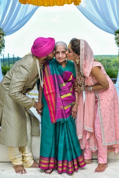Sweet relative being kiss by Indian couple. Sweet relative being kiss by Indian couple.