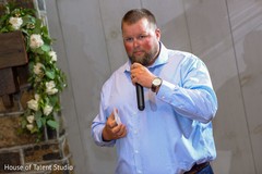 Indian wedding guest giving out a speech capture. Indian wedding guest giving out a speech capture.