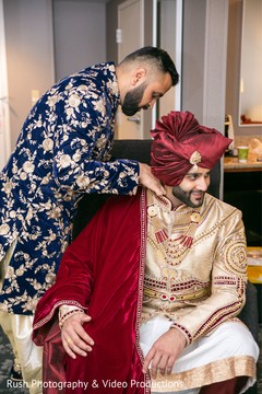 Charming indian groom getting ready scene Charming indian groom getting ready scene