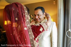 Maharani putting long necklace to father. Maharani putting long necklace to father.