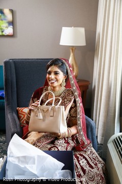 Joyful Indian bride holding her present. Joyful Indian bride holding her present.